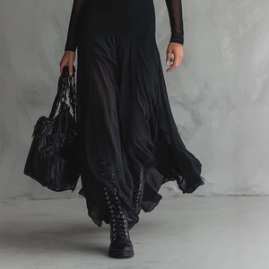 Elegant black mesh patchwork dress set with long sleeve sheer top and a flowing maxi skirt