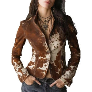 Detail of vintage cow print jacket showing suede texture and antique buttons
