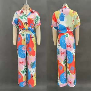 Detailed front and back view of a colorful abstract print shirt and trousers set