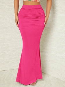 Detail showing hot pink ruched high waist skirt with elegant fishtail hemline