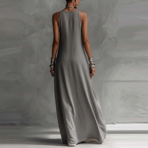 Detail view of the racerback design on a dark gray sleeveless maxi dress with texture