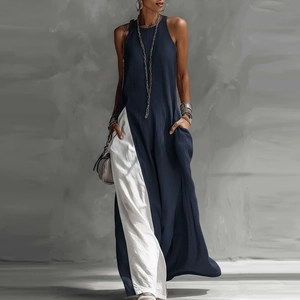 Detail view of the deep blue and white contrast stitching on a sleeveless cotton maxi dress