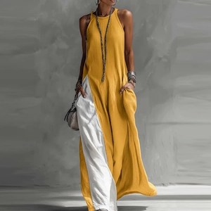 Detail view of ginger and white asymmetric patchwork on a sleeveless loose summer maxi dress