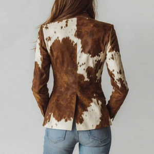 Women's slim fit cow print jacket with back slit and long sleeves on a light background
