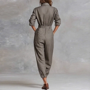 Taupe long sleeve jumpsuit with waist belt and gathered cuffs shown from the back view