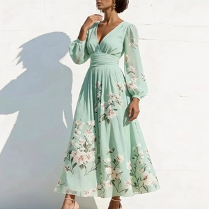 Detail of floral chiffon maxi dress with V-neckline and lanterns sleeves in mint green