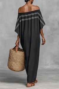 Back view of a loose dark grey off-shoulder maxi dress with subtle striped patterns