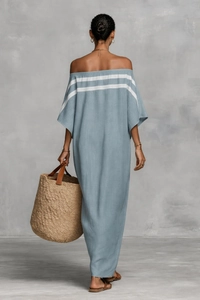 Detail view of the back of a light blue off-shoulder maxi dress with white stripes