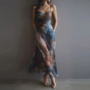 Close-up of lightweight mesh fabric with abstract ink-wash print on a long sling dress