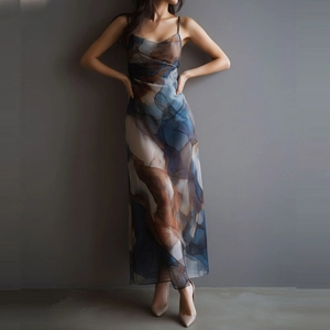 Detail of the sheer mesh fabric with abstract dark blue and brown ink-wash texture print