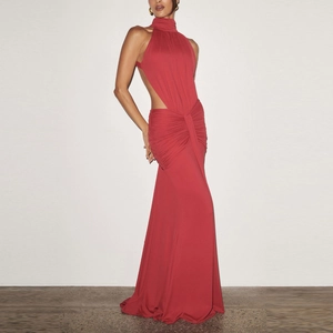 Close-up of backless halter dress with elegant pleated draping and dark red fabric