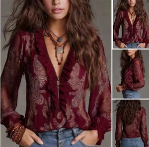 Detail view of burgundy paisley chiffon blouse with V-neck, ruffles and metal zipper