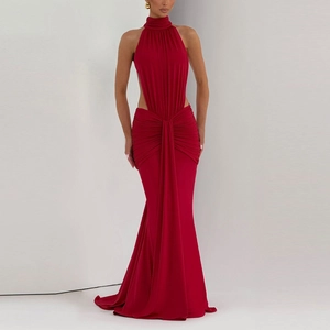 Detail of cross-pleat waist and side cutouts on this deep red halter neck formal gown