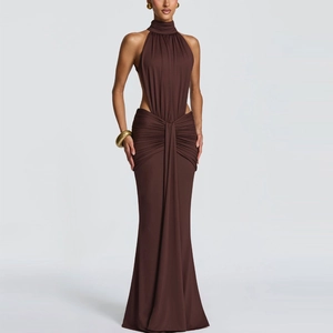 Detail of waist cut-out and draped pleats on this dark brown halter evening gown