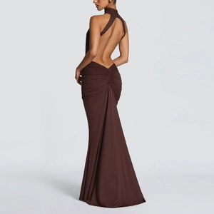 Detail view of backless halter dress with elegant waist ruching and fisheye hemline