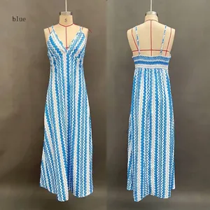 Detail of V-neck summer dress with blue wave patterns and smocked elastic back detail
