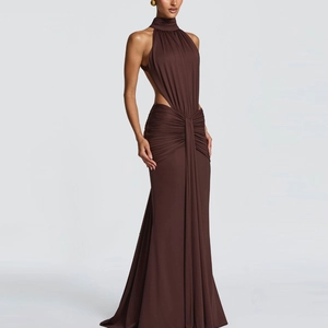 Detailed view of brown halter neck dress with waist cutout and elegant ruched texture