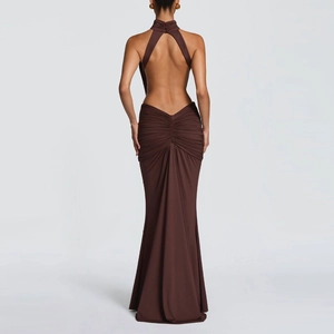 Macro detail of the backless halter neckline and ruched waist on the brown evening gown