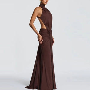 Detail of dark brown halter neck dress showing waist cutout and ruched fabric texture