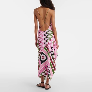 Detail of cross straps and backless design on geometric print irregular maxi dress
