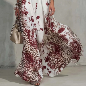 Detail of floral leopard print chiffon maxi dress with high slit and flowing skirt
