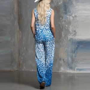 Rear view of stylish women's leopard print set with blue gradient sleeveless top and wide pants