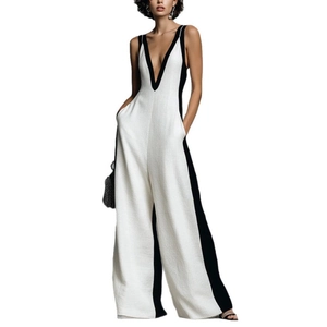 Combinaison bicolore noir et blanc sans manches avec col en V profond et jambes larges