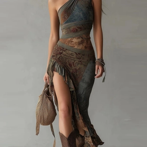Detail of bohemian one-shoulder maxi dress featuring vintage print and ruffled high slit
