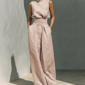 Detail of beige sleeveless linen two-piece set featuring wide-leg pants and pocket design