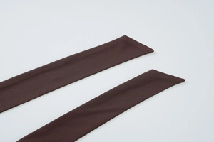 Detail view of dark brown halter neck ties showing the fine ribbed fabric texture and stitching