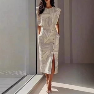 Detail of a two-piece set with geometric print featuring shoulder pads and buttoned split skirt