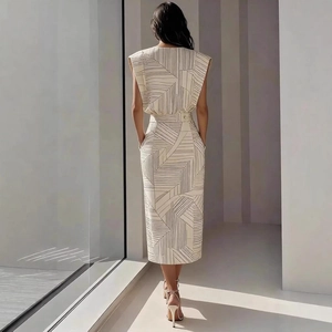 Detail of printed sleeveless midi dress featuring waist belt and side pockets back view