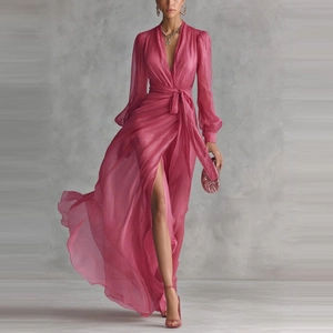 Detailed view of magenta v-neck chiffon dress showing waist tie and high split flowy fabric