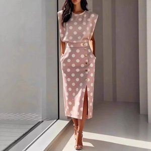 Women's two-piece set featuring sleeveless polka dot top and side slit midi skirt with buttons