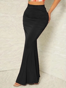 Detail view of high waist ruched mermaid skirt with elegant black slimming silhouette
