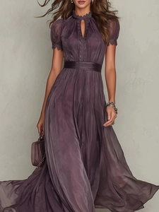 Close-up of V-neck ruffled chiffon dress featuring vertical pleated texture and lace trims