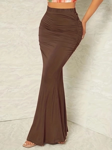 Detailed view of dark coffee high-waisted ruched fishtail skirt with side pleats