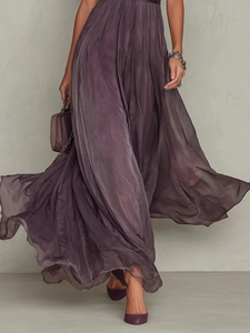 Detailed view of deep purple chiffon maxi dress with ruffled hem and flowy pleated design