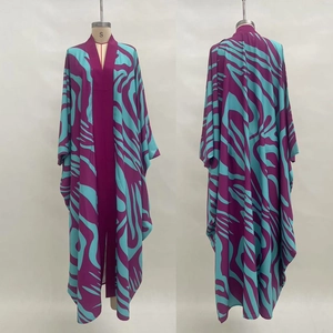 Detail of loose fit beach robe with purple zebra print and long wide sleeves