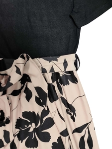 Romantic floral tie-waist dress with black ribbed knit top and beige flower print skirt