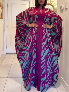 Detailed view of exotic purple and teal zebra print on a loose bohemian kaftan robe