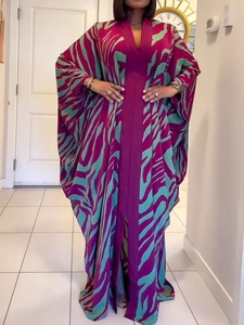 Close-up of V-neck and batwing sleeve detail on purple zebra print long kaftan dress