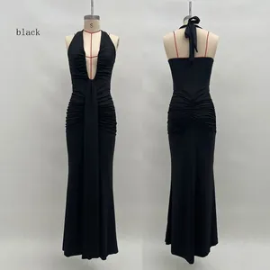 Detail of elegant black deep V-neck halter dress with ruching and open back design
