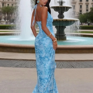 Detail of light blue halter backless maxi dress with tie-up back and tie-dye pattern