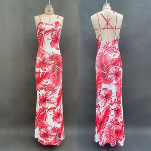 Detail of red floral print and crossover back straps on white summer maxi dress
