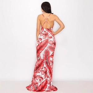 Back view of tropical floral maxi dress featuring a criss-cross open back design