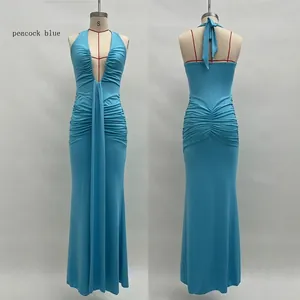 Detail of peacock blue evening gown showing deep V-neckline and elegant ruched waist texture