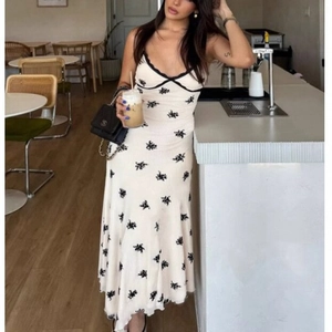 Women's cream floral midi dress with black lace V-neck and slim fit sling style