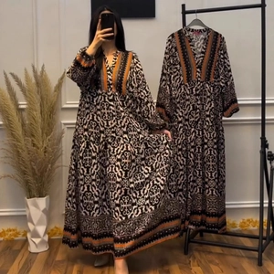 Ethnic V-neck maxi dress with geometric print and orange striped trim in a loose silhouette