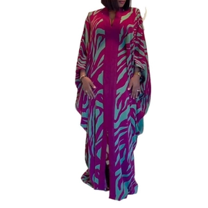 Magenta kaftan robe with mint green zebra print and V-neckline in a loose long fit